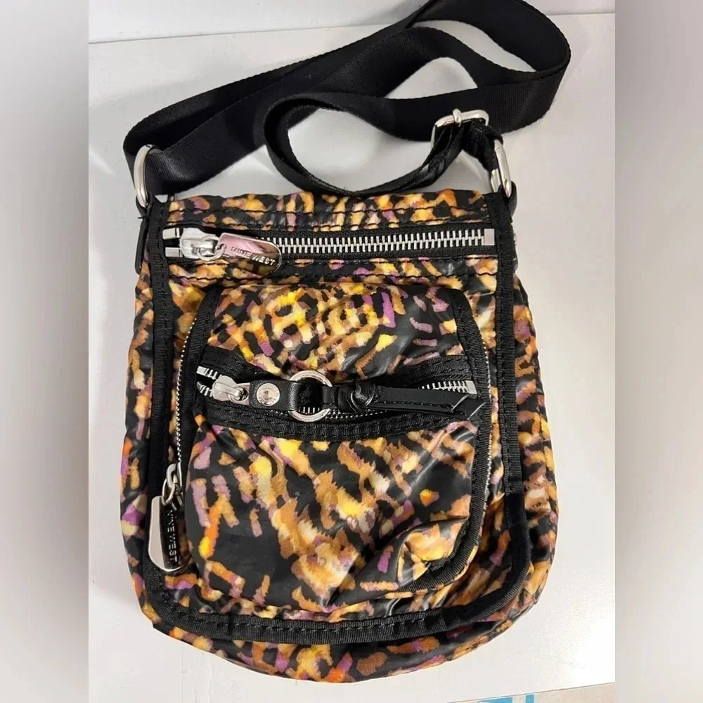 Nine West, animal print multi zipper compartments, magnetic snap over flap front